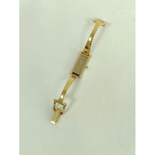 95 - Gucci gilt metal evening watch and eight others, quartz.