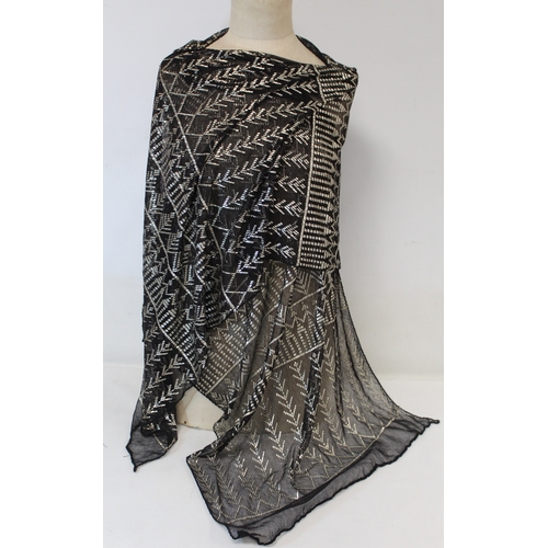 415 - Egyptian Assuit silver and black net shawl, approx. 240cm x 53cm; also a small beaded black and silv... 