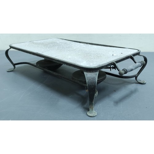 634 - Rectangular metal hot plate on scroll supports with two burners and a rectangular stand.  (2).