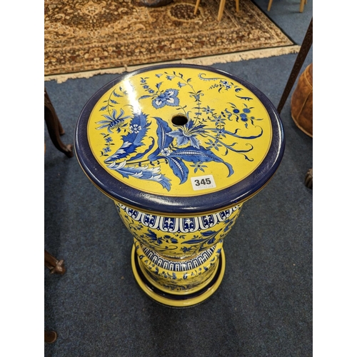 462 - 20th century pottery jardinière stand, the yellow ground decorated with blue floral spray, 71... 