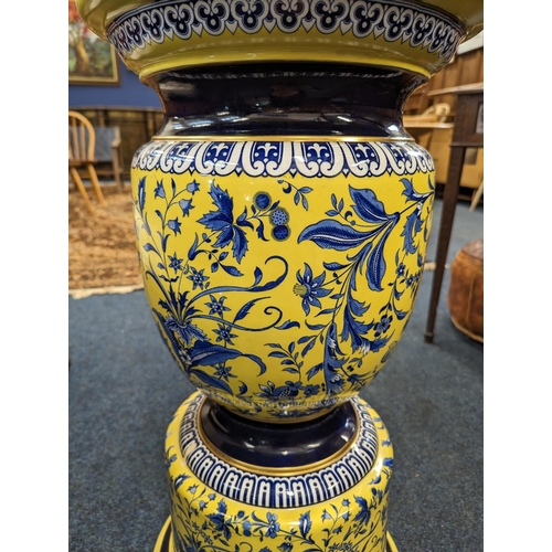 462 - 20th century pottery jardinière stand, the yellow ground decorated with blue floral spray, 71... 