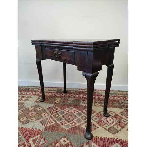 597 - 18th century mahogany card table, the shaped top opening  to reveal four square wells and a later gr... 