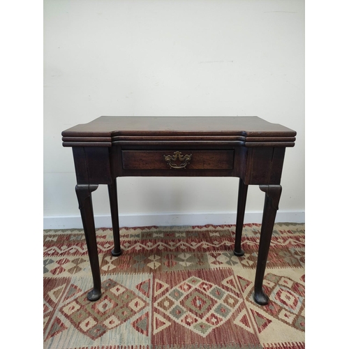 597 - 18th century mahogany card table, the shaped top opening  to reveal four square wells and a later gr... 