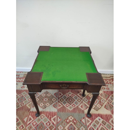 597 - 18th century mahogany card table, the shaped top opening  to reveal four square wells and a later gr... 