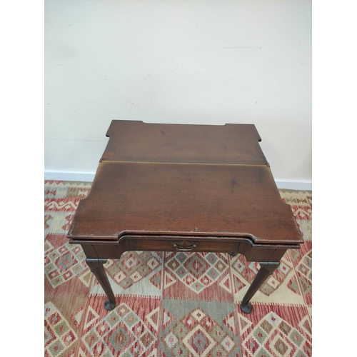 597 - 18th century mahogany card table, the shaped top opening  to reveal four square wells and a later gr... 