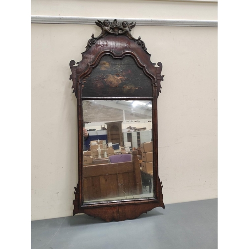 645 - Georgian wall mirror, the old rectangular plate surmounted by a painted blind panel in walnut fret f... 