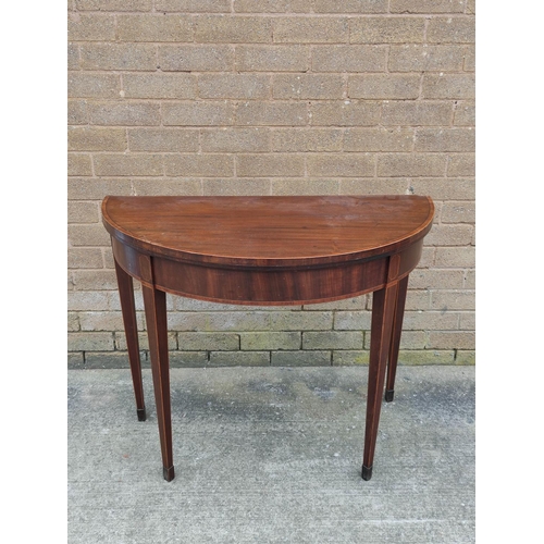 663 - Georgian mahogany card table with crossbanding raised on square tapering supports 91cm