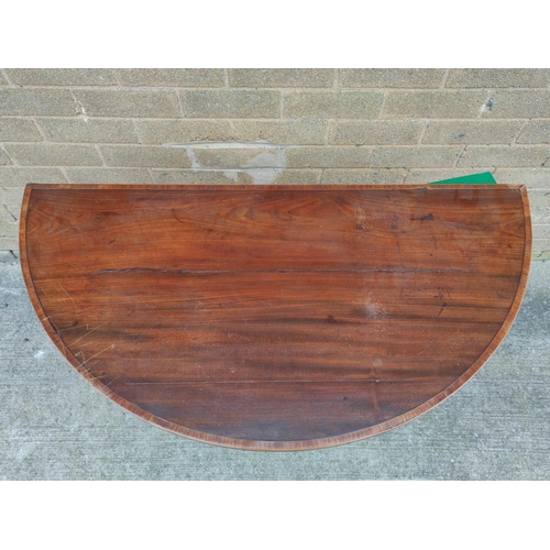 663 - Georgian mahogany card table with crossbanding raised on square tapering supports 91cm