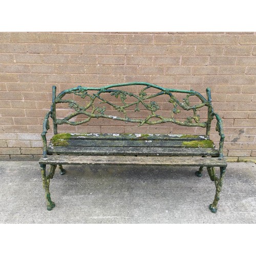 654 - Victorian Coalbrookdale style iron garden seat of overall foliate branch pattern with slatted wood s... 