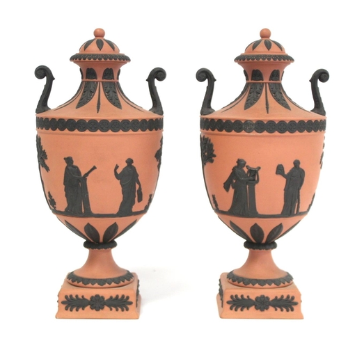 180 - Pair of 20th Century Wedgwood Rosso Antico covered vases of urn form with twin scroll handles, conti... 