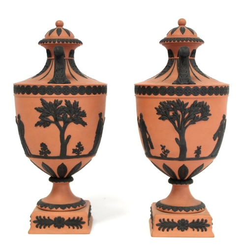 180 - Pair of 20th Century Wedgwood Rosso Antico covered vases of urn form with twin scroll handles, conti... 