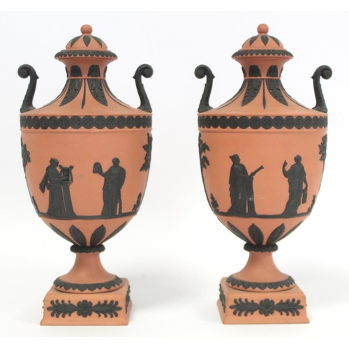 180 - Pair of 20th Century Wedgwood Rosso Antico covered vases of urn form with twin scroll handles, conti... 