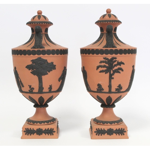 180 - Pair of 20th Century Wedgwood Rosso Antico covered vases of urn form with twin scroll handles, conti... 