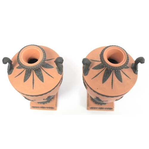 180 - Pair of 20th Century Wedgwood Rosso Antico covered vases of urn form with twin scroll handles, conti... 