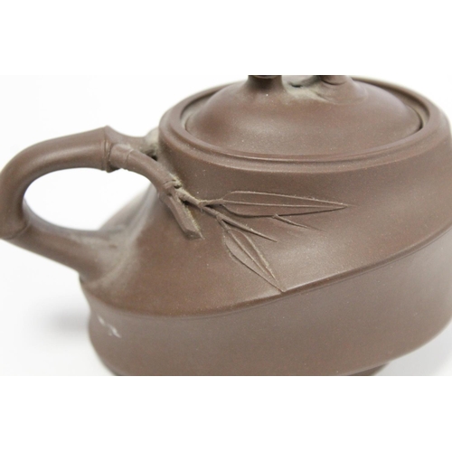 174 - Chinese Yixing pottery teapot of ovoid form, the main body moulded as bamboo cane with similar spout... 