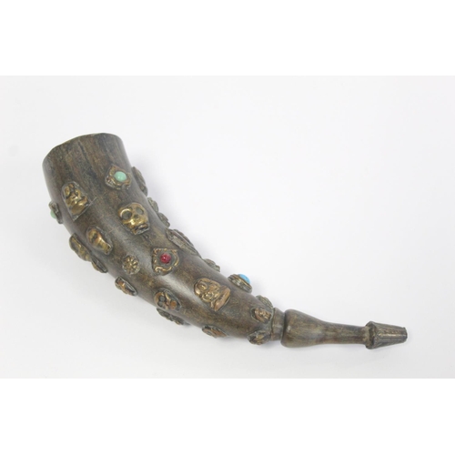 176 - Tibetan horn with carved and shaped end and applied repousse metal masks with inset turquoise and ot... 