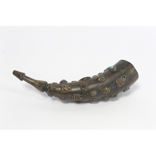 176 - Tibetan horn with carved and shaped end and applied repousse metal masks with inset turquoise and ot... 