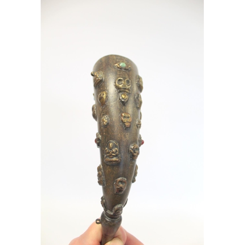 176 - Tibetan horn with carved and shaped end and applied repousse metal masks with inset turquoise and ot... 