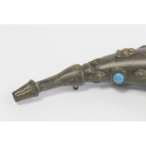 176 - Tibetan horn with carved and shaped end and applied repousse metal masks with inset turquoise and ot... 