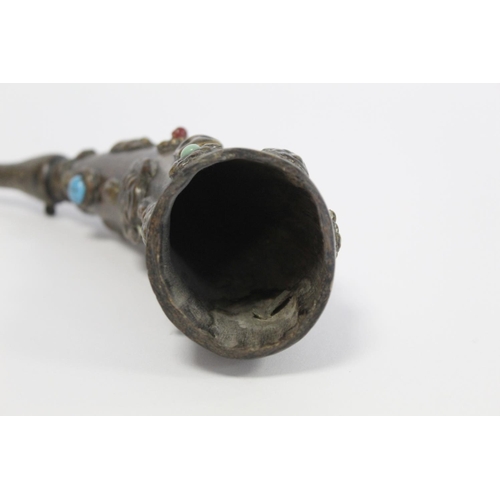 176 - Tibetan horn with carved and shaped end and applied repousse metal masks with inset turquoise and ot... 