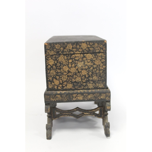 179 - Early 19th century Chinese export black lacquer box on pierced stand with painted gilt floral and sc... 