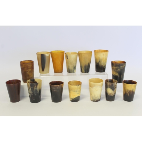 388 - Collection of fourteen horn beakers, the largest 8.5cm high, the smallest 7cm high.  (14).