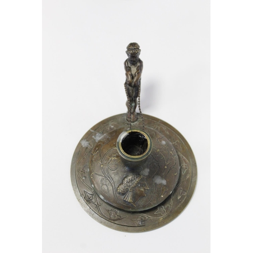 392 - Antique bronze Continental chamberstick of circular form with incised floral, foliate and geometric ... 