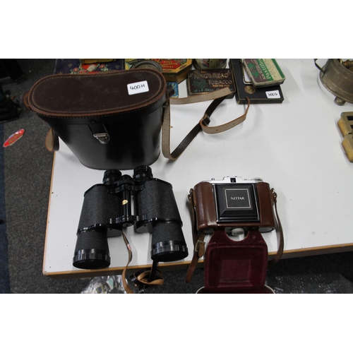 400H - Cased set of binoculars and a vintage Nettar camera.