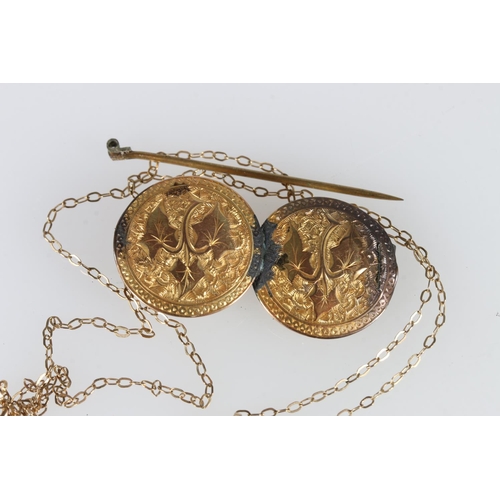 488 - 9k gold brooch formed from two buttons (?) 4cm diameter, and 9k gold chain with clear and blue stone... 