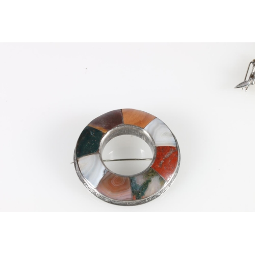 490 - Circular Celtic polished stone and white metal brooch, 6.5cm diameter, and other silver brooches to ... 