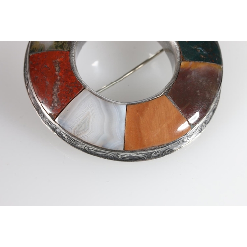 490 - Circular Celtic polished stone and white metal brooch, 6.5cm diameter, and other silver brooches to ... 