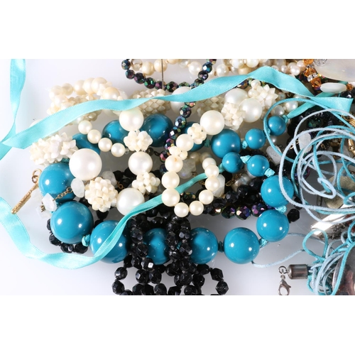 493 - Costume jewellery to include, necklaces, badges, brooches, beads, etc.