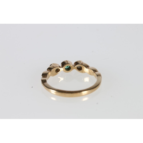 530 - 9ct gold emerald and diamond three-stone ring, 1.8g.