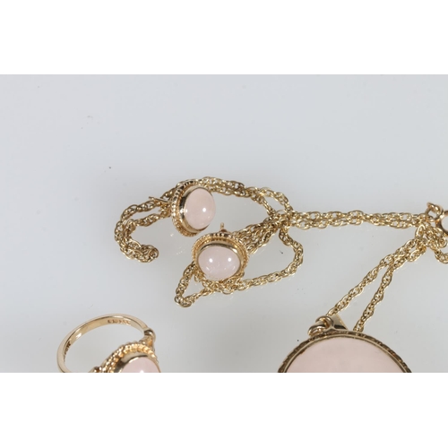 535 - 9ct gold mounted white quartz pendant on 9ct gold chain, also a similar ring and a pair of earrings,... 