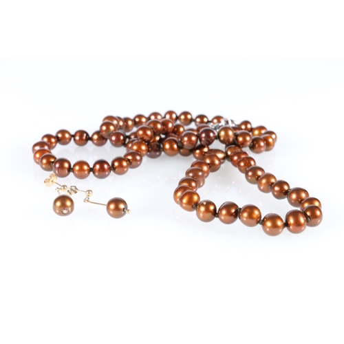 540 - Pair of 9ct gold and copper brown pearl drop earrings 2.8g gross and a copper brown pearl necklace.