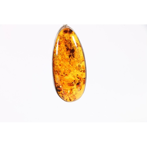 541 - Silver mounted amber pendant, a pair of matching earrings, another pair of similar earrings, and an ... 