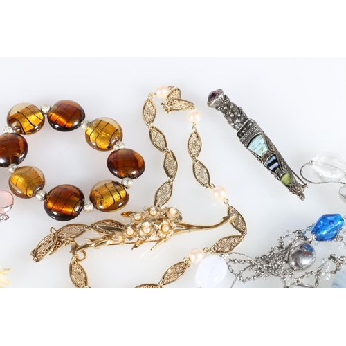 544 - Costume jewellery to include a Bucher floral spray bracelet, a filigree necklace, an Elanor Caie Rak... 