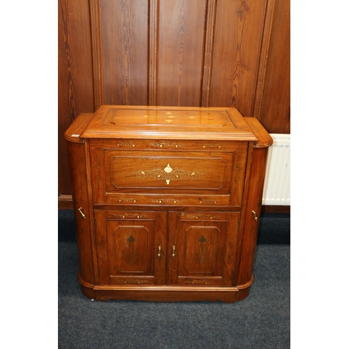 602 - Indian cocktail cabinet, with brass foliate inlay, with an arrangement of hinged doors and top, on p... 