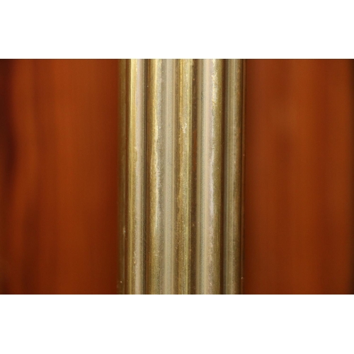 627 - Brass curtain reeded curtain rail, along a quantity of curtain rings, rod measures 251cm.