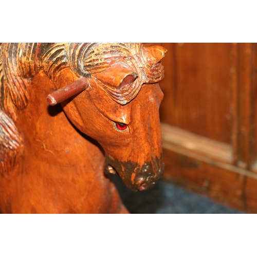 636 - Carved wood child's rocking horse, 61cm high.