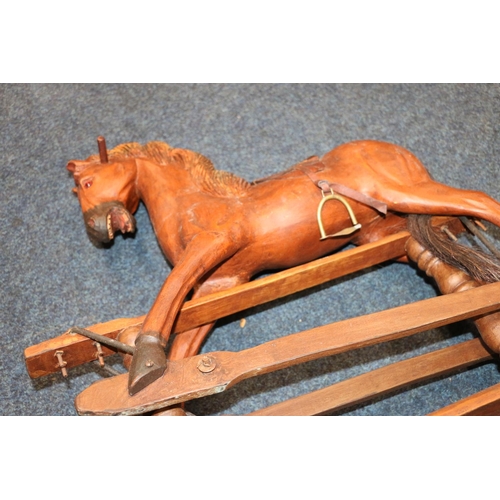 636 - Carved wood child's rocking horse, 61cm high.