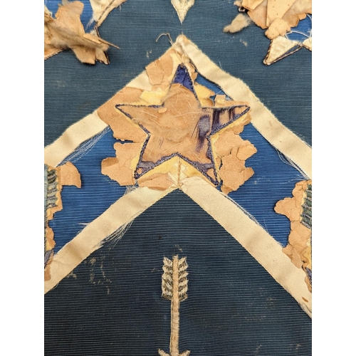 435 - Needlework heraldic banner with castle turret, stars and arrows, 55cm x 46cm.