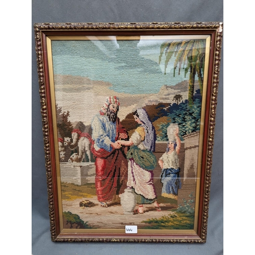 444 - Antique needlework panel depicting a religious scene with watercarriers and camels, 'Rebekah at the ... 