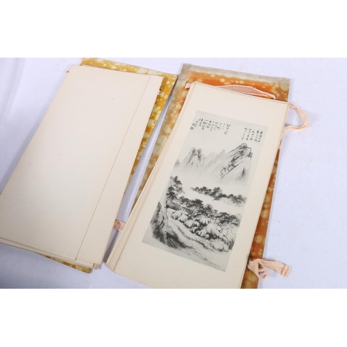 119 - Oriental folder containing prints.