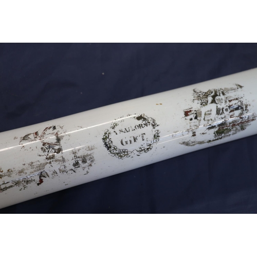 127 - Large glass rolling pin decorated with scenes of servicemen, titled 'A Sailor's Gift', 75cm long.