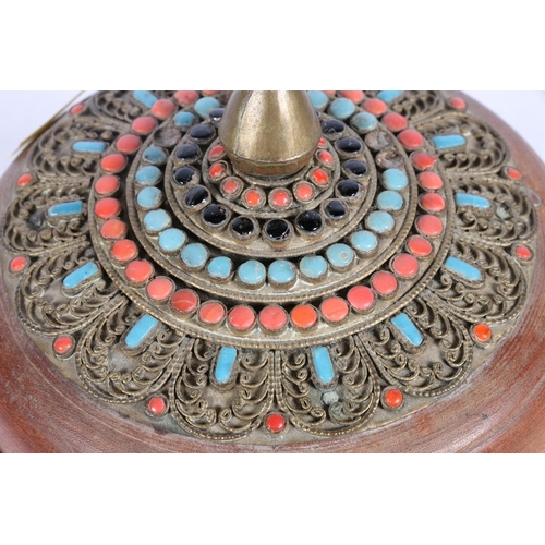 13 - Tibetan treen pencil jar and cover, decorated with metal work banding and set with coral and blue st... 