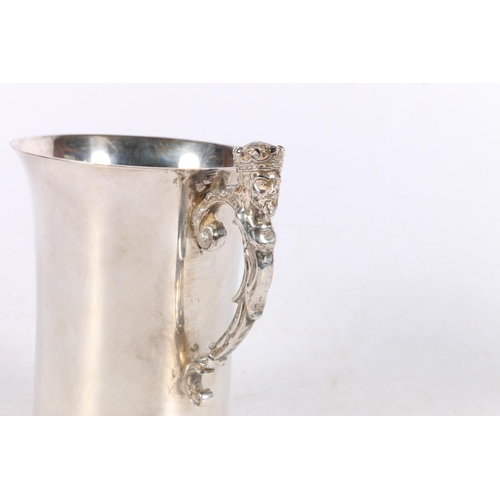 136 - Liberty & Co. silver-plated mug, with flared rim and crowned head figure handle, initials 'C A' ... 