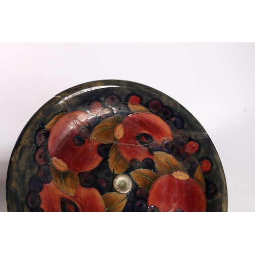 140 - Moorcroft plate, mounted on a metal stand, 14cm high x 22cm diameter., and a footed dish with glass ... 