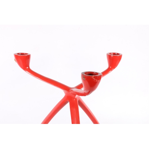 155 - Cast metal red painted three branch candelabra of mid-century design, 30cm long.