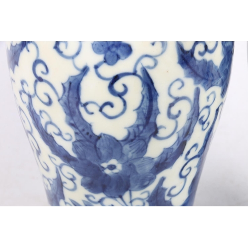 177 - Pair of Chinese blue and white vases, with covers, 26cm high.